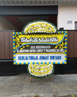 Papan Bunga Duka di Woloan Satu